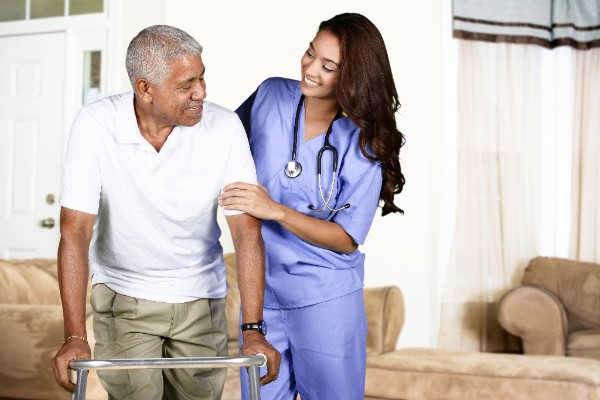Deciphering Senior Living Options Nursing home assistant helping and elderly gentleman